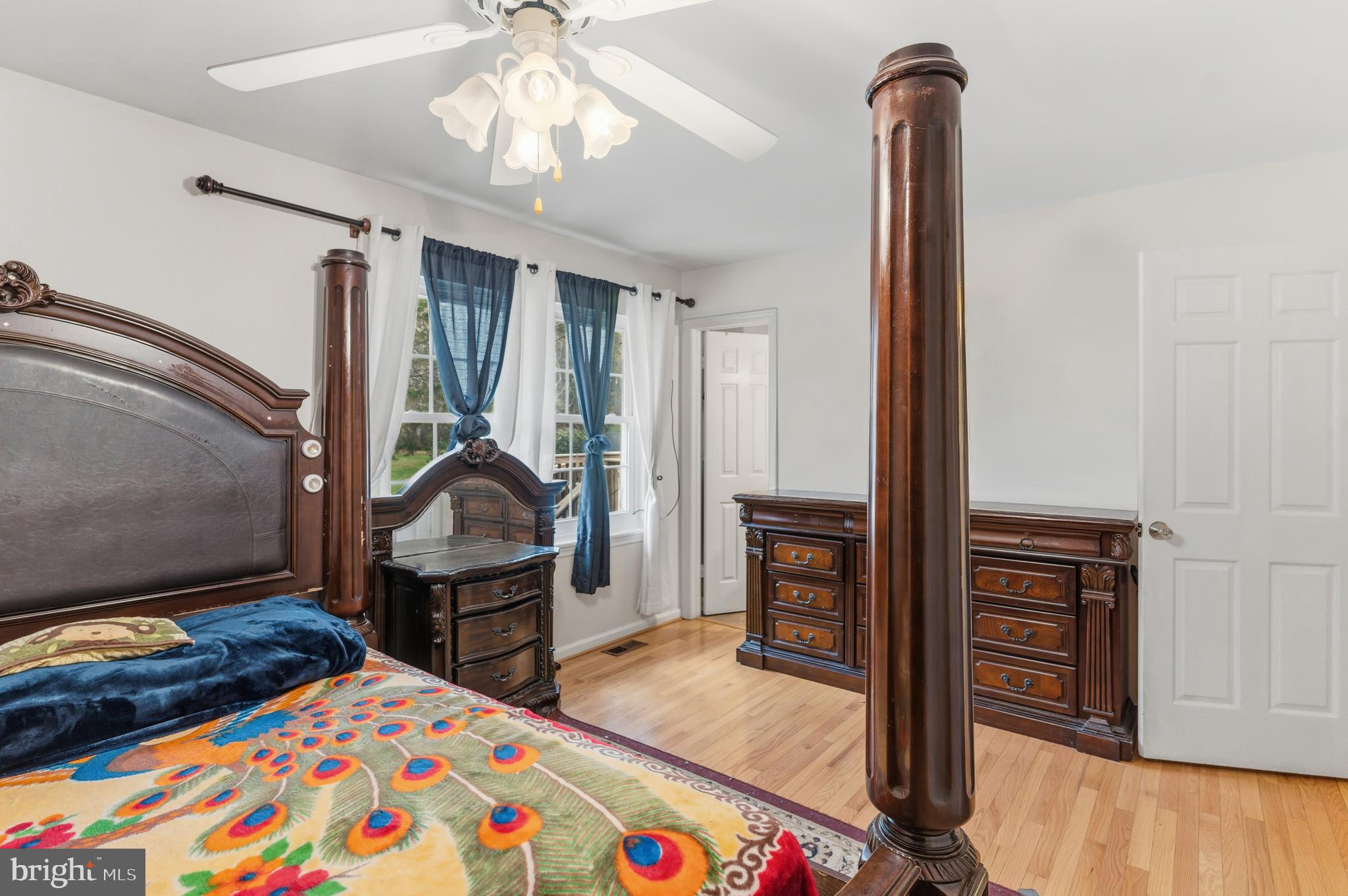 12574 Bristow Road Nokesville, VA 20181 - Photo 20 of 38 a bedroom with furniture and a wooden floor