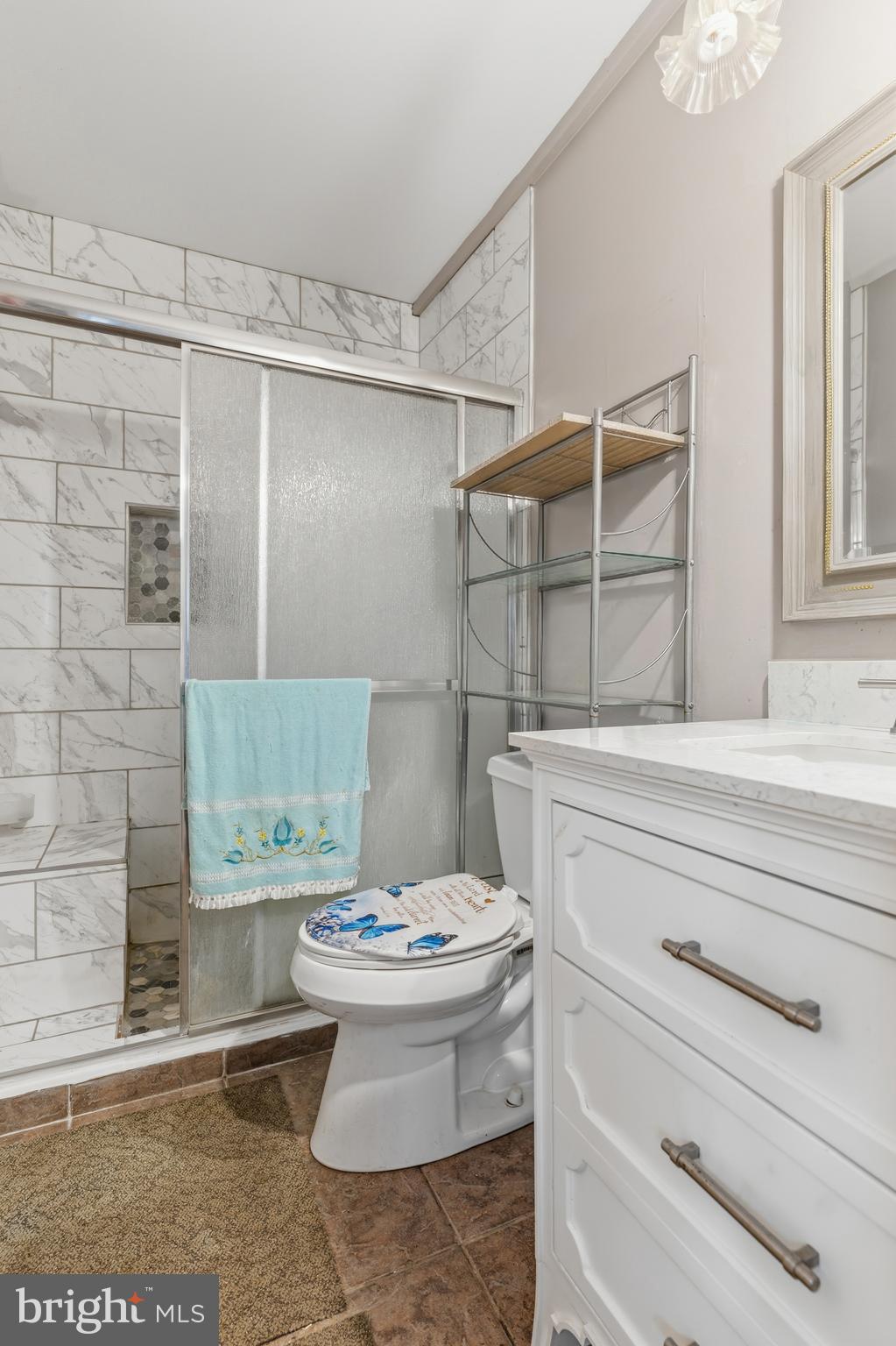 12574 Bristow Road Nokesville, VA 20181 - Photo 21 of 38 a bathroom with a sink toilet and shower