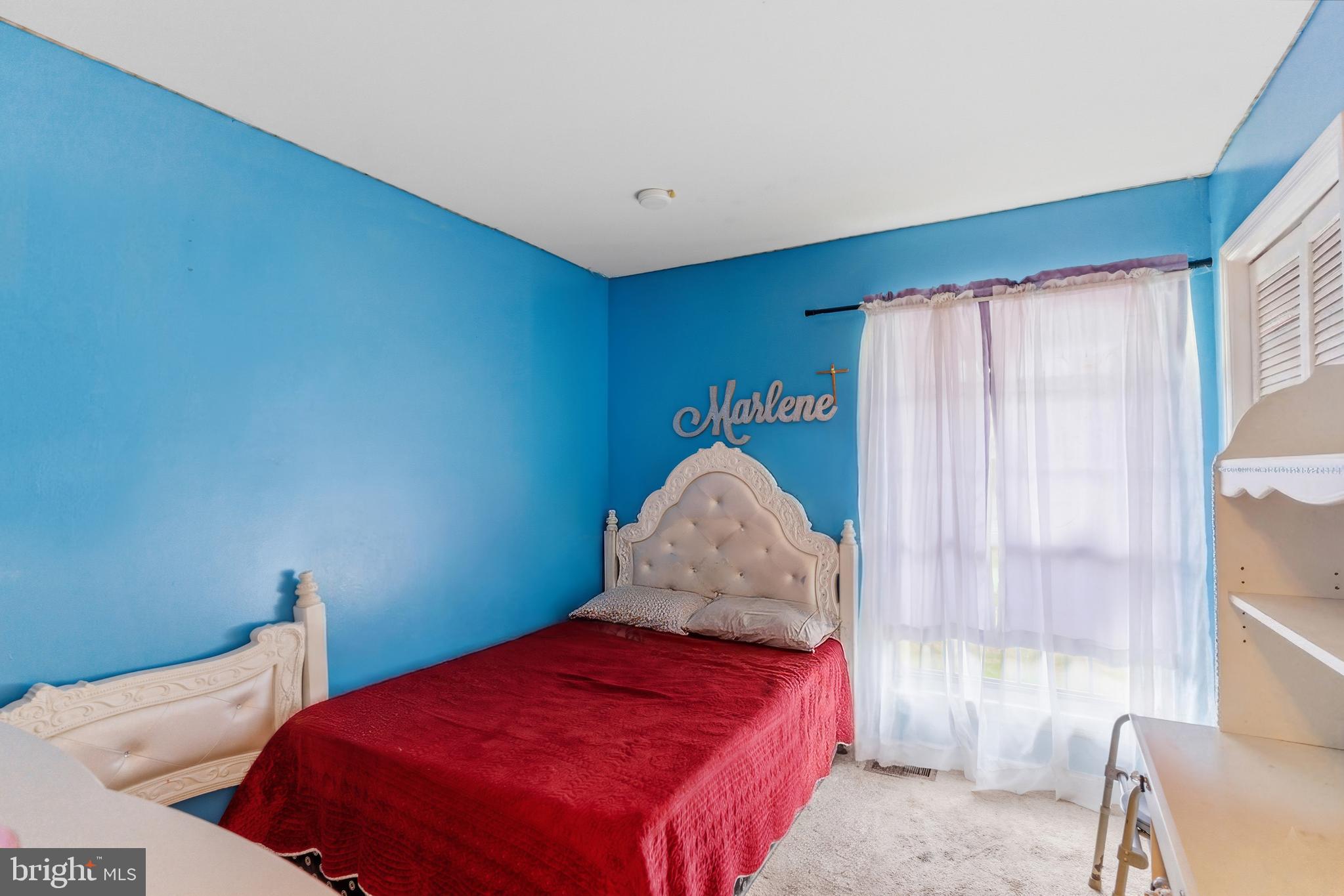 12574 Bristow Road Nokesville, VA 20181 - Photo 24 of 38 a bedroom with a bed and a window