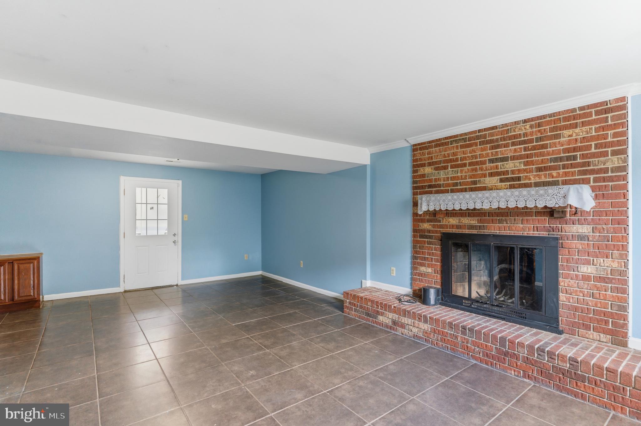 12574 Bristow Road Nokesville, VA 20181 - Photo 25 of 38 a view of empty room with a fireplace