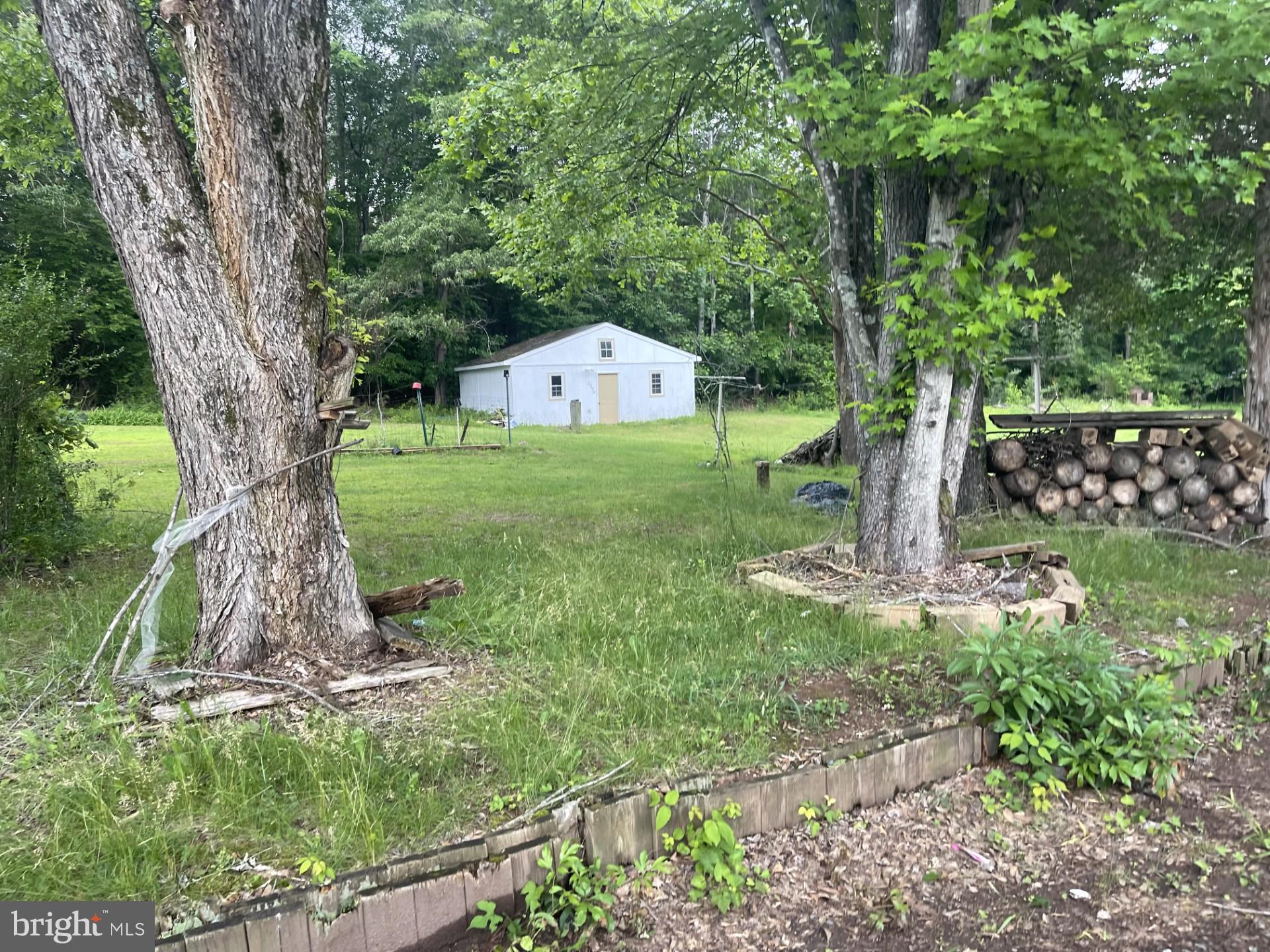 12574 Bristow Road Nokesville, VA 20181 - Photo 8 of 38 a front view of a house with garden
