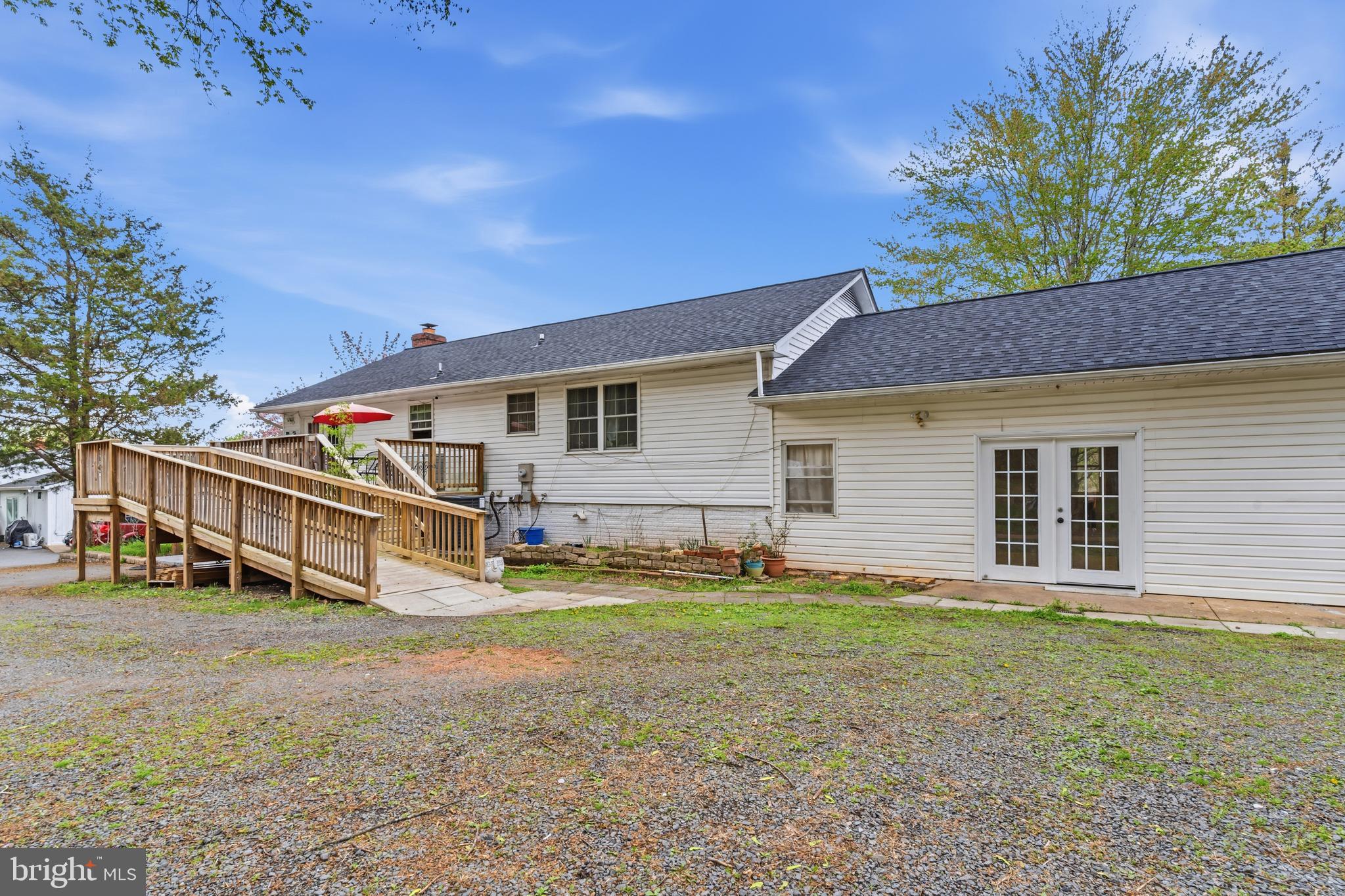 12574 Bristow Road Nokesville, VA 20181 - Photo 9 of 38 a view of a house with a yard and sitting area