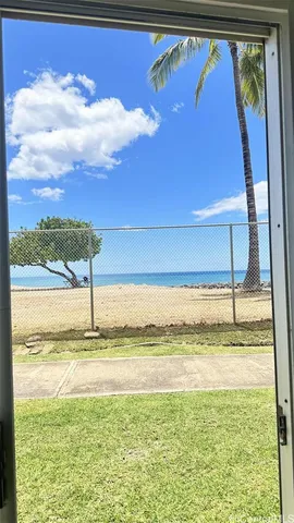 a view of a swimming pool with a yard
