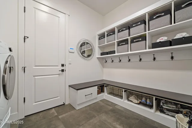 a bathroom with a double vanity sink a toilet a bathtub and shower