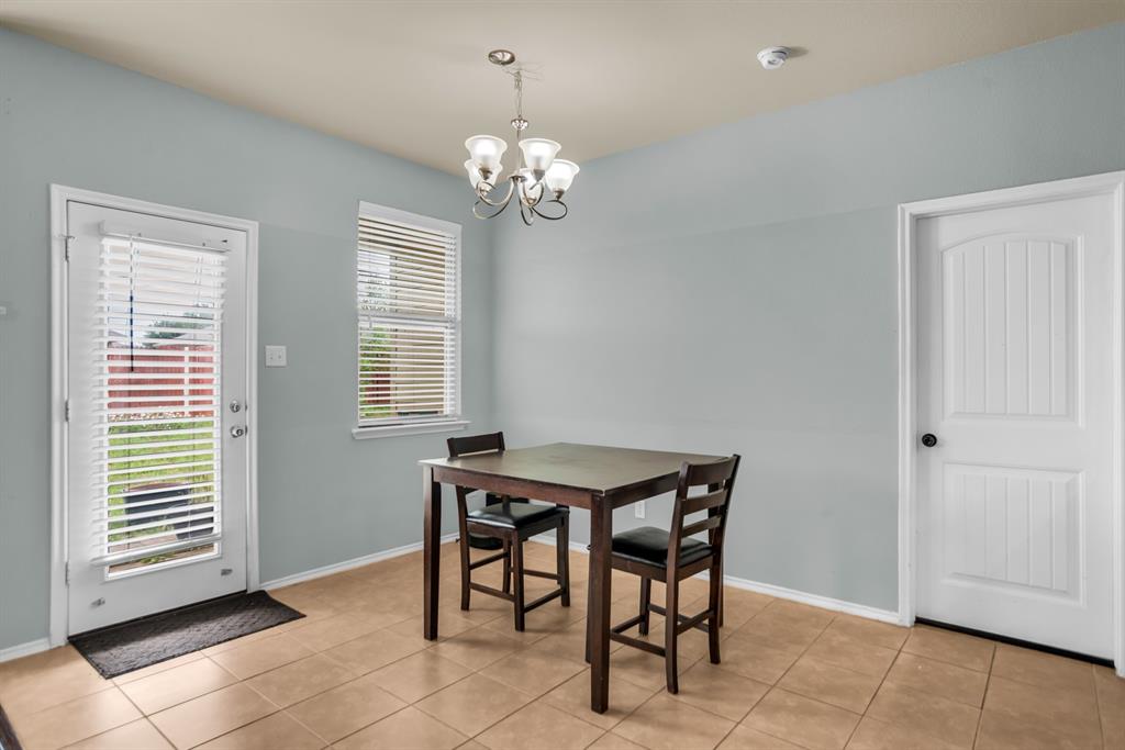 2114 Cedar Trail Anna, TX 75409 - Photo 11 of 34 a view of a dining room with furniture and chandelier