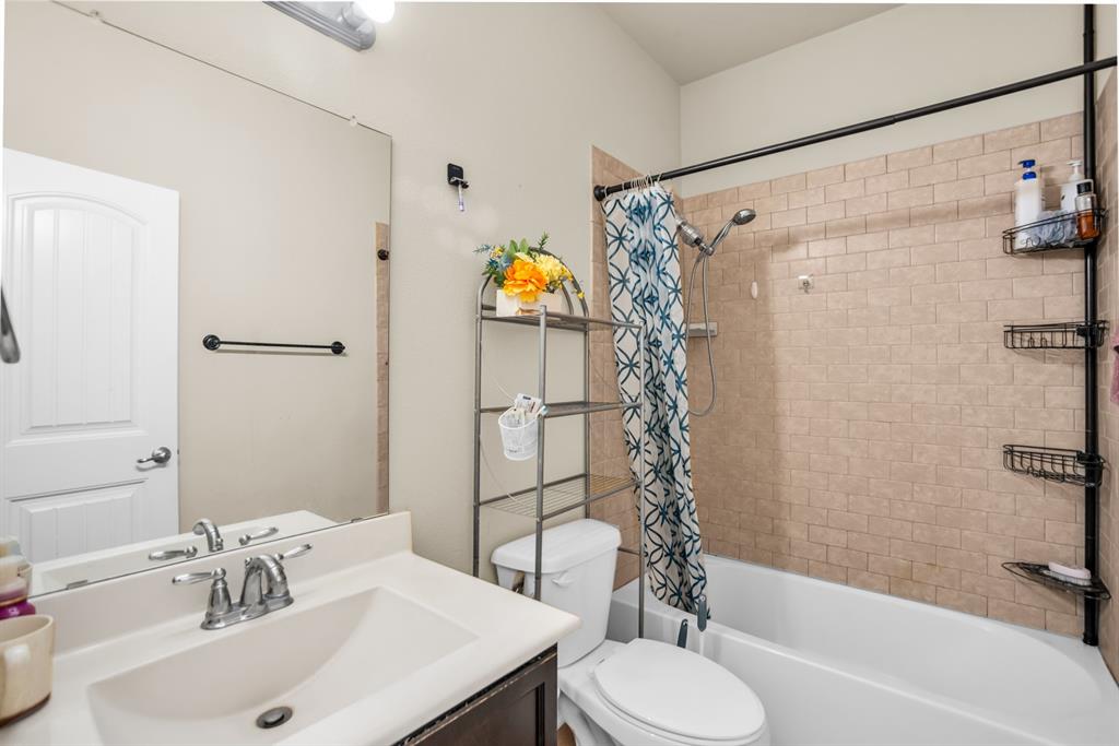 2114 Cedar Trail Anna, TX 75409 - Photo 18 of 34 a bathroom with a sink toilet and shower