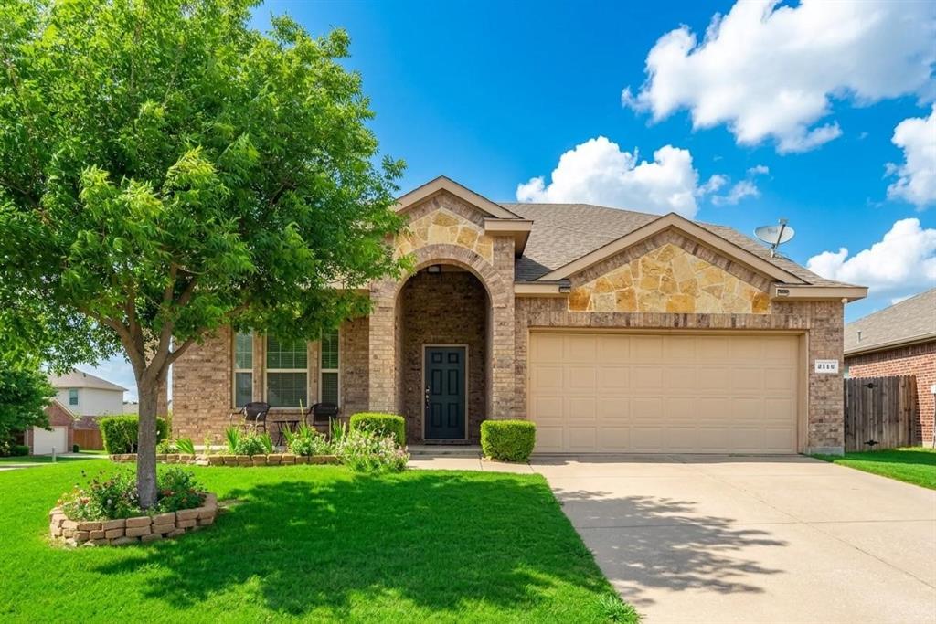 2114 Cedar Trail Anna, TX 75409 - Photo 2 of 34 a front view of a house with a garden and yard