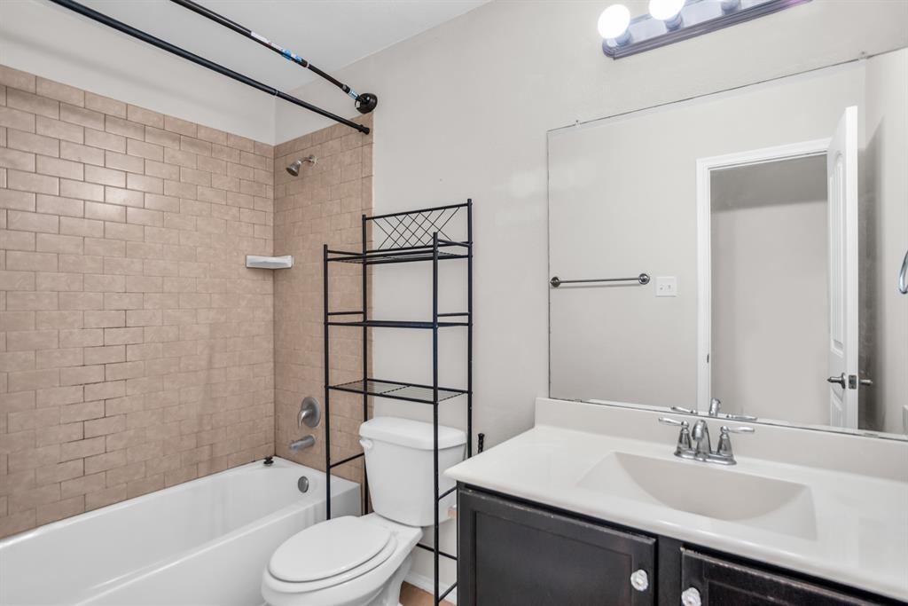 2114 Cedar Trail Anna, TX 75409 - Photo 21 of 34 a bathroom with a sink toilet and shower