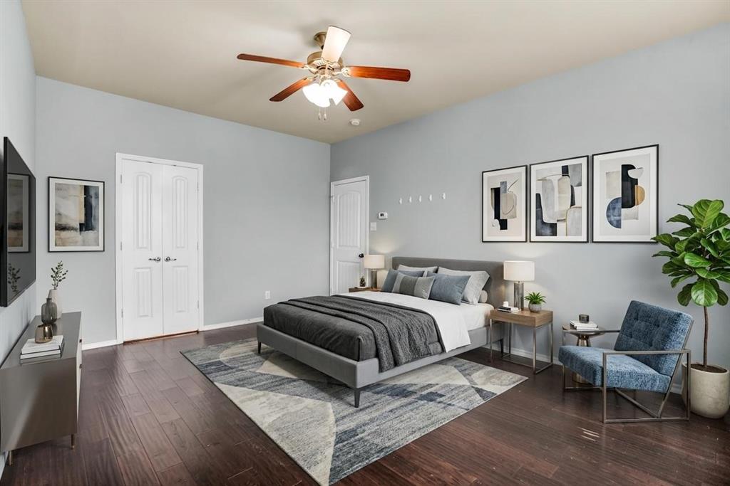 2114 Cedar Trail Anna, TX 75409 - Photo 23 of 34 a spacious bedroom with a bed a couch and potted plant on the dresser