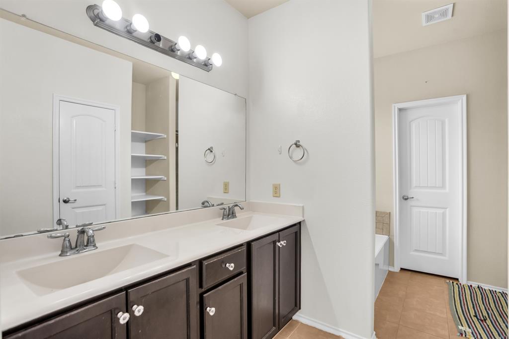 2114 Cedar Trail Anna, TX 75409 - Photo 27 of 34 a bathroom with a sink double vanity and a mirror