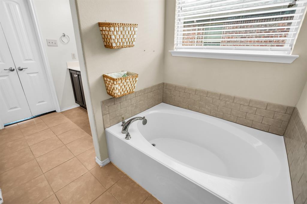 2114 Cedar Trail Anna, TX 75409 - Photo 28 of 34 a bathroom with a bathtub