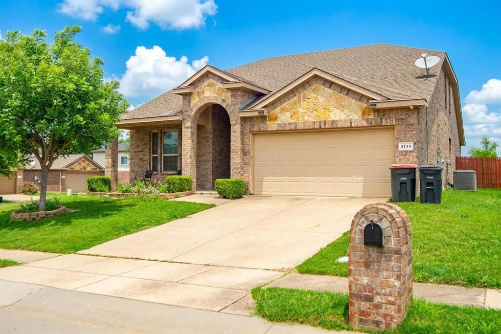 2114 Cedar Trail Anna, TX 75409 - Photo 3 of 34 a front view of a house with a yard and garage