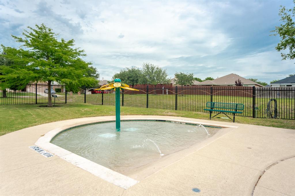 2114 Cedar Trail Anna, TX 75409 - Photo 6 of 34 a view of a swimming pool with a yard