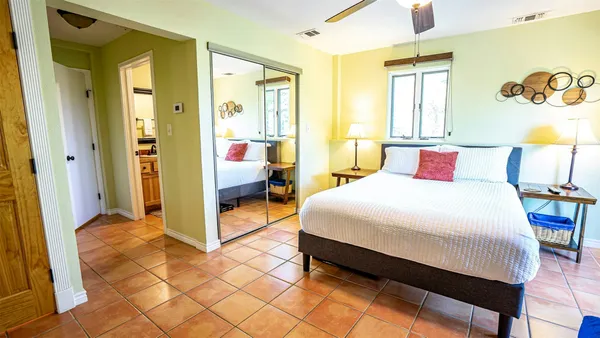 a bedroom with a bed and a table