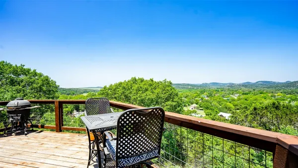 a view of balcony with furniture