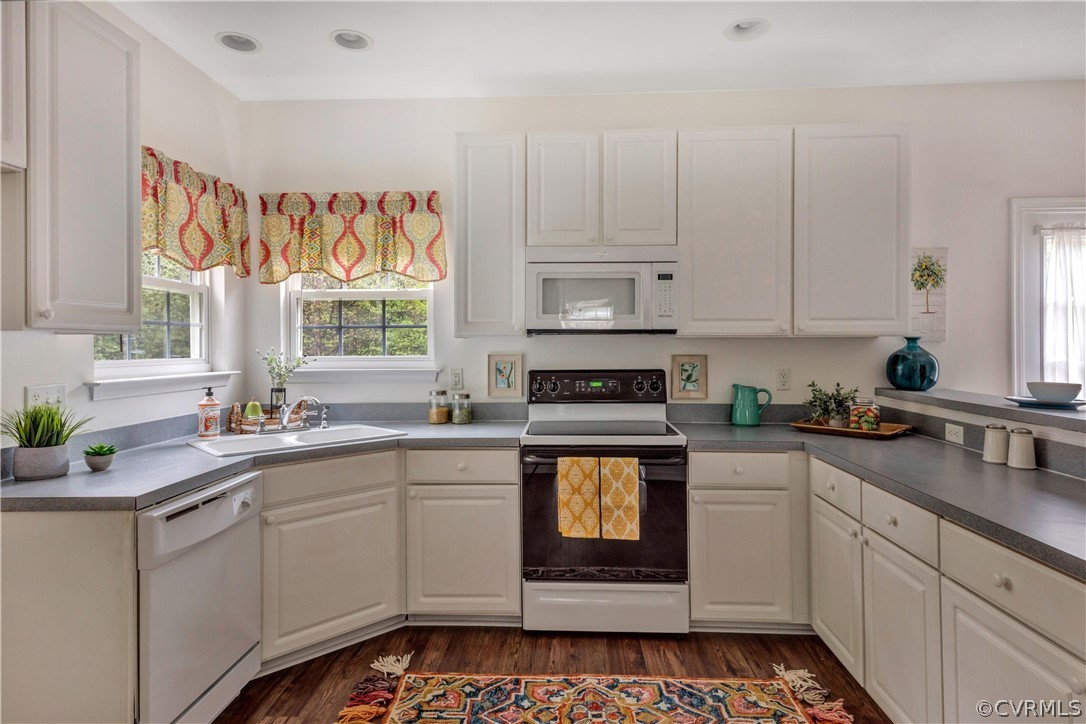 19907 Ivan Road Petersburg, VA 23803 - Photo 5 of 26 a kitchen with stainless steel appliances a stove a sink and white cabinets