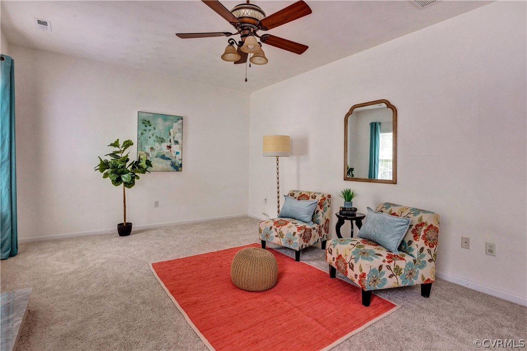 19907 Ivan Road Petersburg, VA 23803 - Photo 8 of 26 a living room with furniture and a potted plant