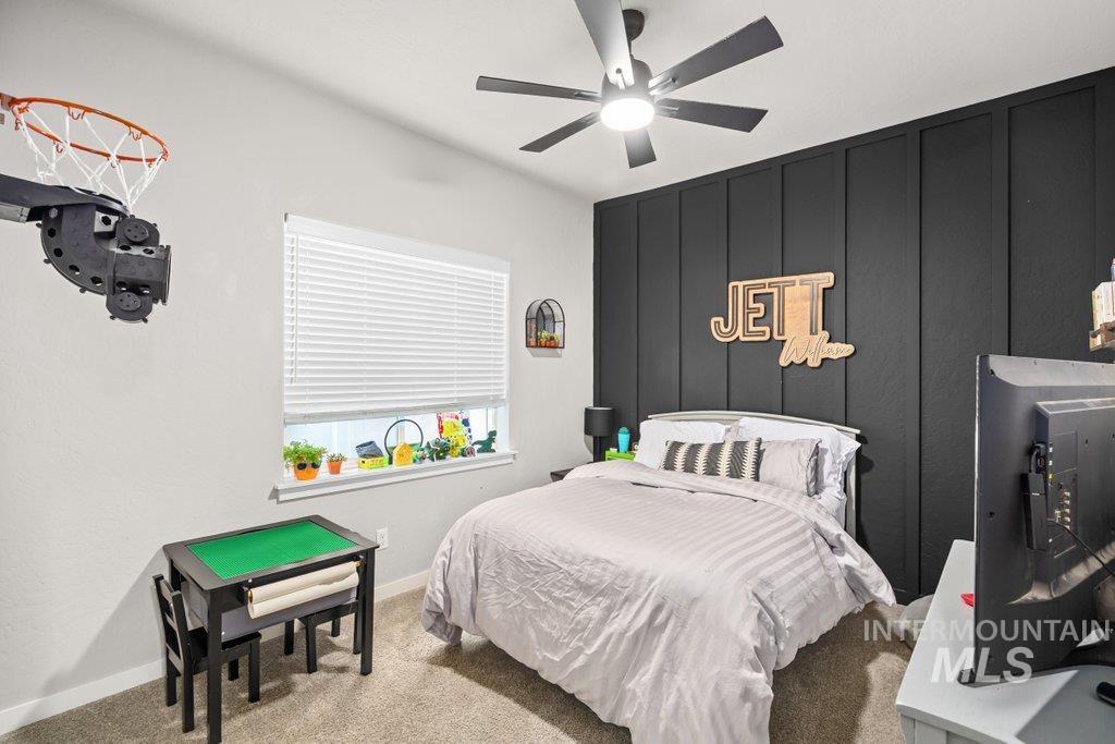 6697 West Irish Circle Rathdrum, ID 83858 - Photo 13 of 36 Carpeted bedroom with a decorative wall and a ceiling fan