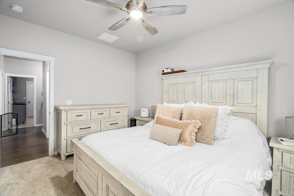 6697 West Irish Circle Rathdrum, ID 83858 - Photo 20 of 36 Bedroom featuring light colored carpet and a ceiling fan