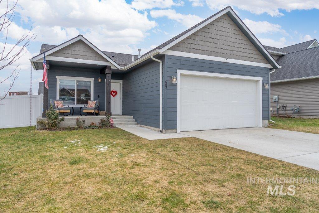 6697 West Irish Circle Rathdrum, ID 83858 - Photo 35 of 36 View of front of property featuring concrete driveway and a garage