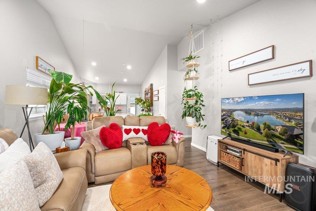 6697 West Irish Circle Rathdrum, ID 83858 - Photo 3 of 36 Living area with recessed lighting, wood finished floors, and lofted ceiling