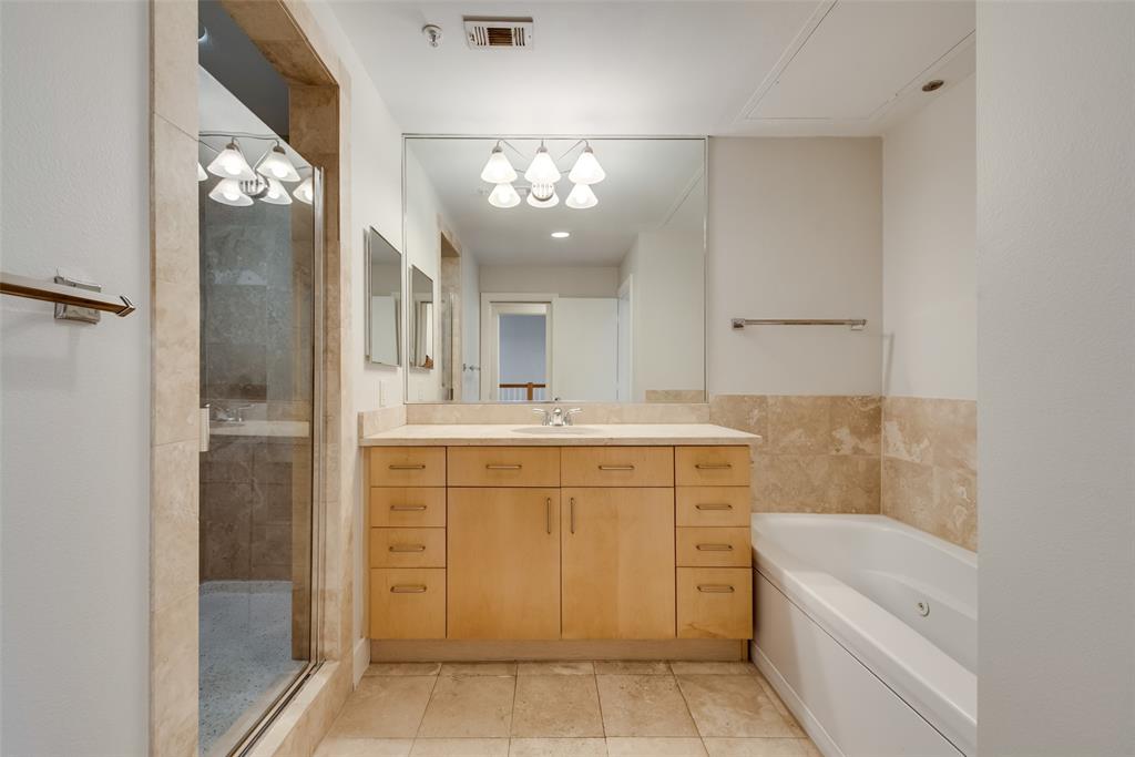 5055 Addison Circle, Unit 407 Addison, TX 75001 - Photo 20 of 22 Main Part of Primary Bathroom; Second Vanity and Toilet are Adjacent (pocket door can separate the two areas)