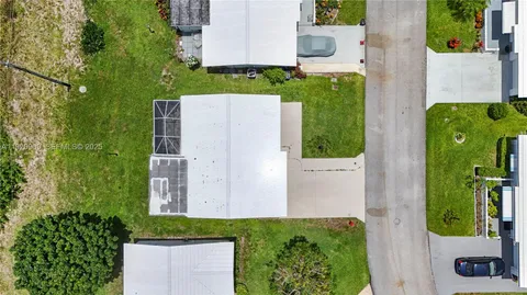 an aerial view of a house having yard
