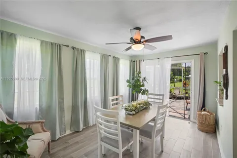 a view of a livingroom with furniture and a potted plant