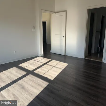 an empty room with a empty space and a window