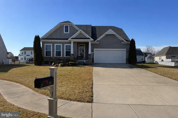 a front view of a house with yard