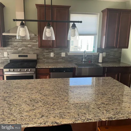 a kitchen with sink and window