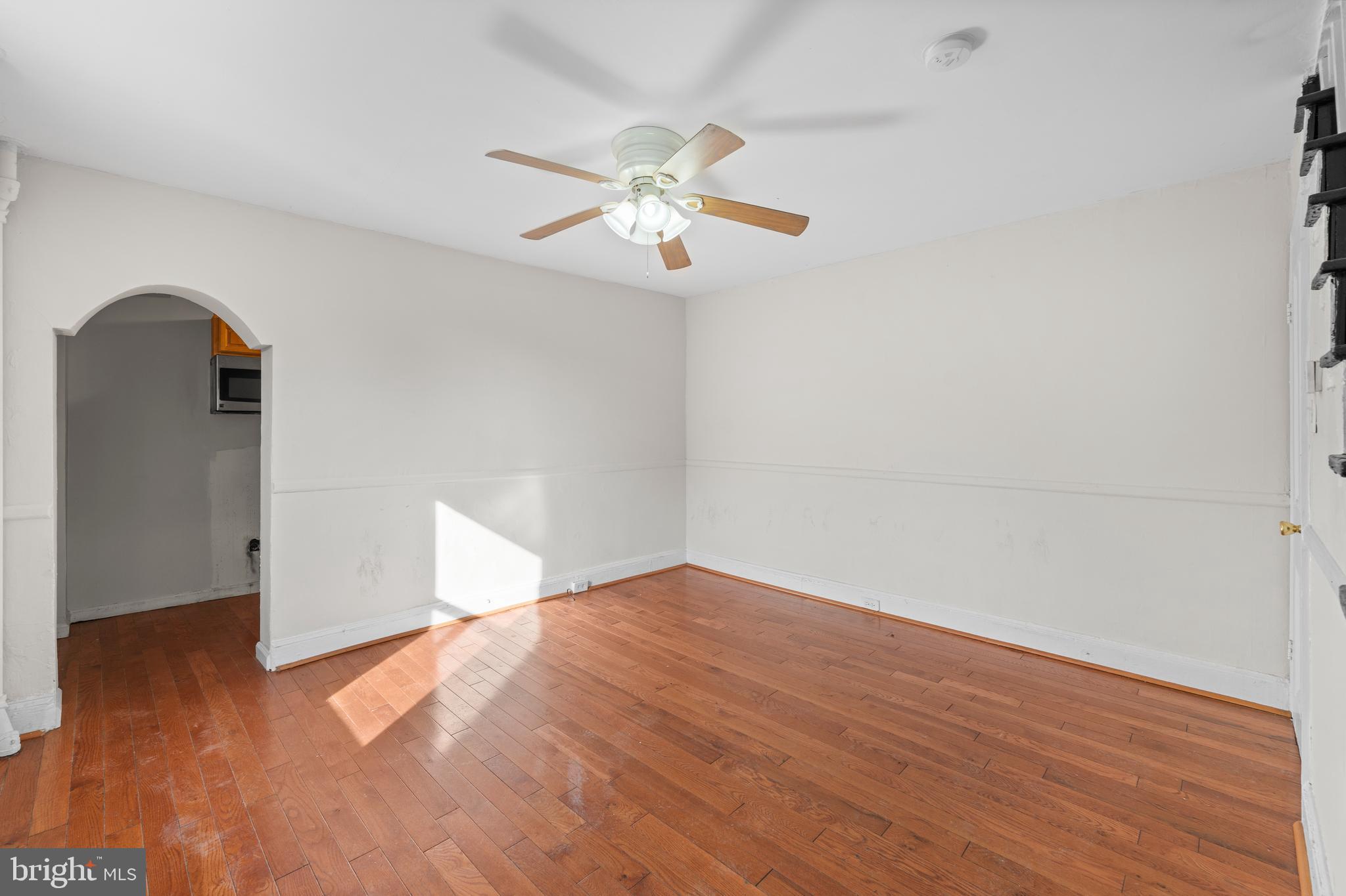 421 Mechanic Street Philadelphia, PA 19144 - Photo 11 of 20 wooden floor in an empty room with a window