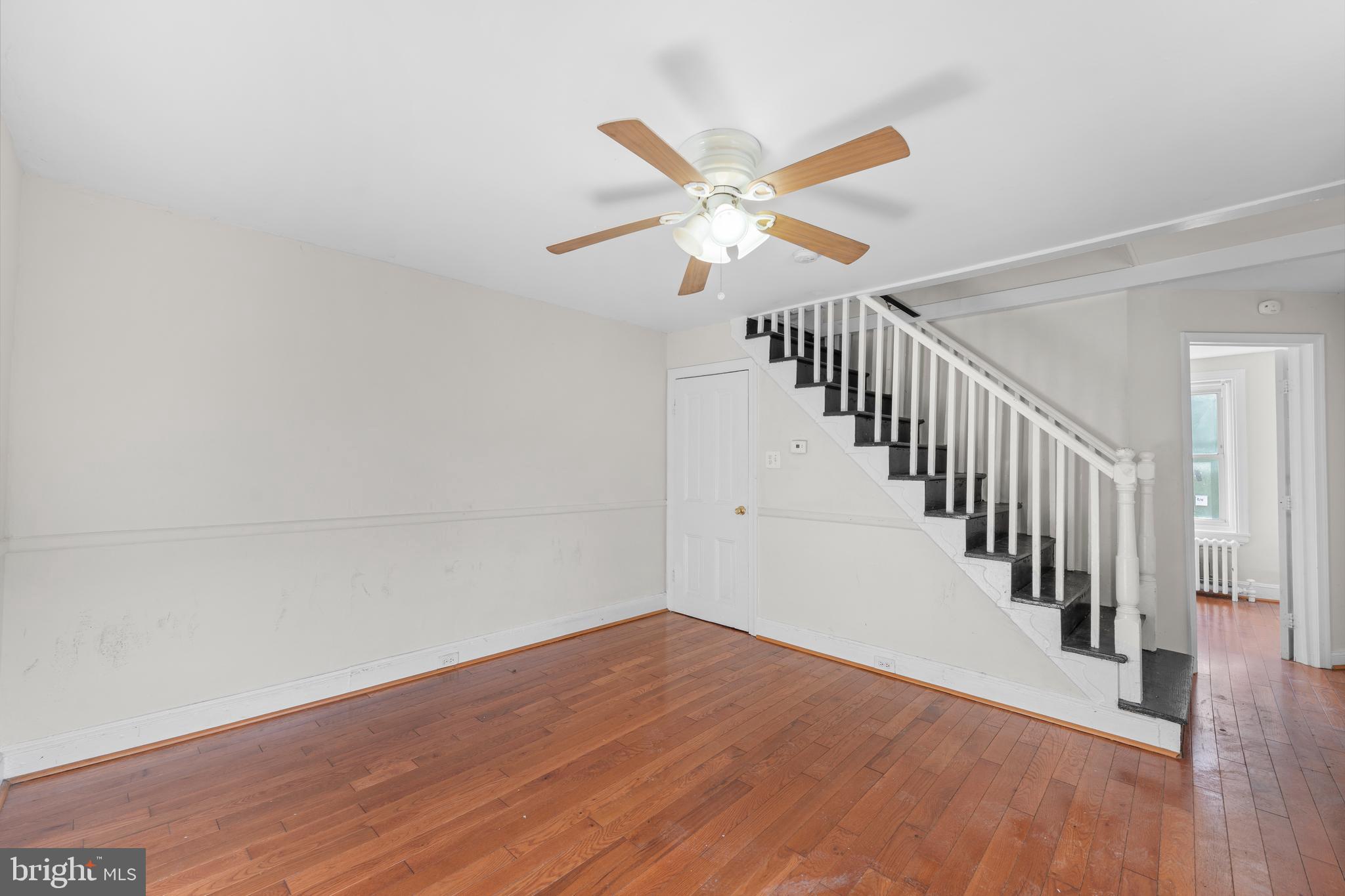 421 Mechanic Street Philadelphia, PA 19144 - Photo 12 of 20 a view of a hallway with wooden floor and staircase