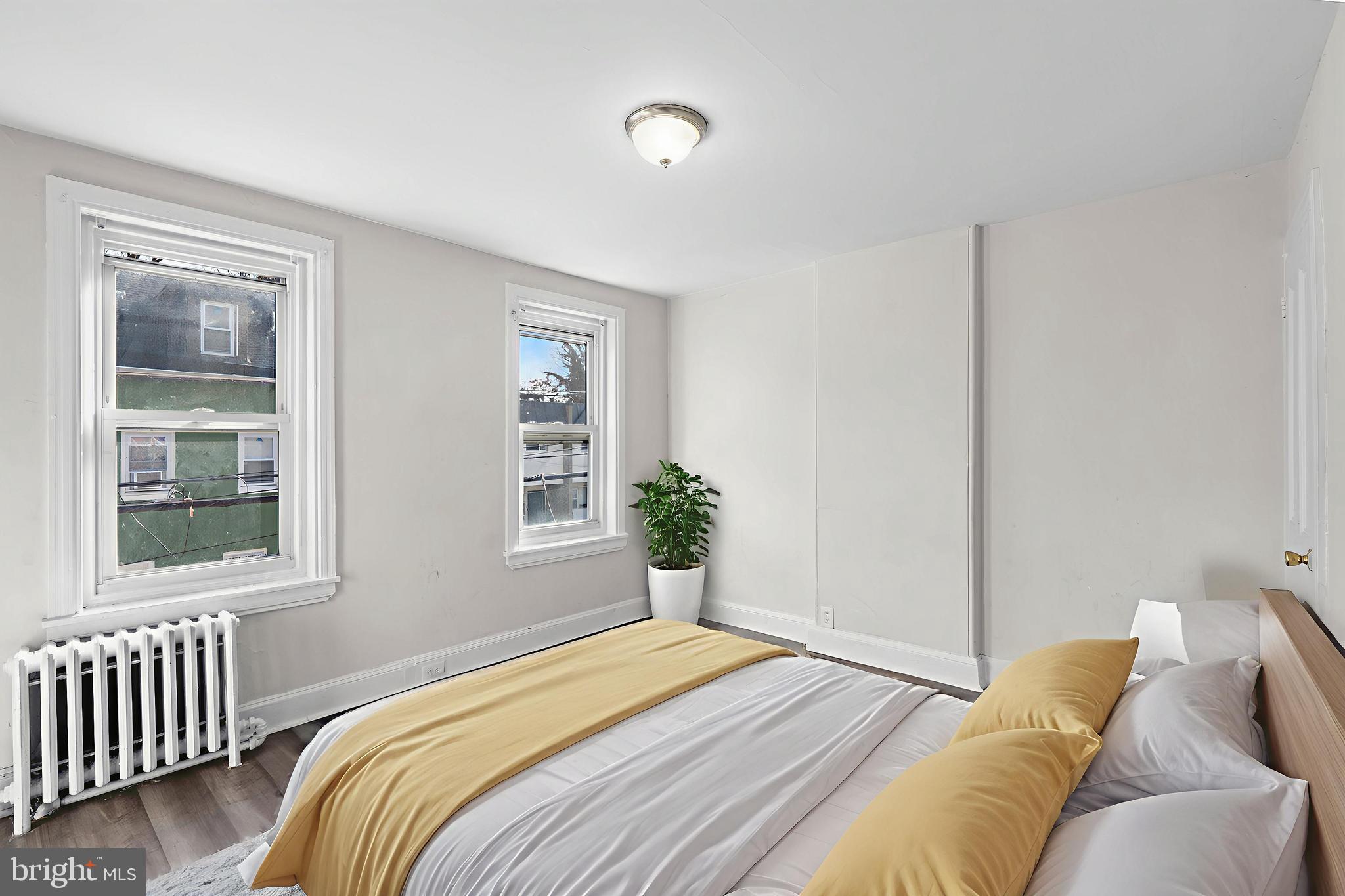 421 Mechanic Street Philadelphia, PA 19144 - Photo 8 of 20 a bedroom with a bed and a window