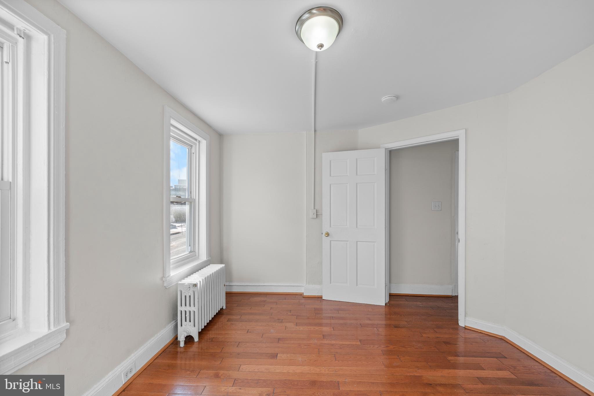 421 Mechanic Street Philadelphia, PA 19144 - Photo 10 of 20 a view of an empty room with wooden floor and a window