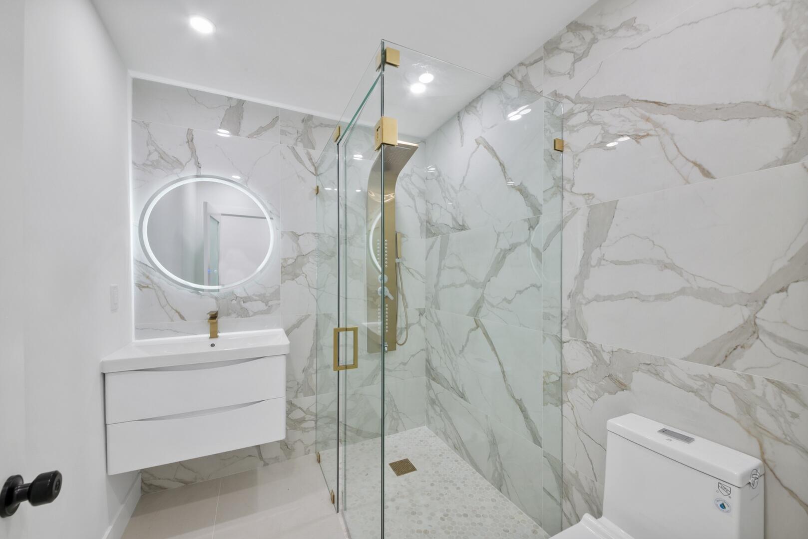 860 Northwest 70th Street Miami, FL 33150 - Photo 14 of 25 a bathroom with a sink toilet and shower