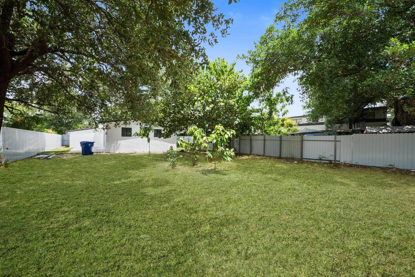860 Northwest 70th Street Miami, FL 33150 - Photo 19 of 25 a backyard of a house with lots of green space