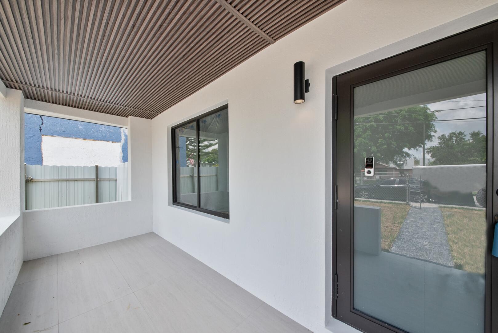 860 Northwest 70th Street Miami, FL 33150 - Photo 2 of 25 a view of an empty room with a window