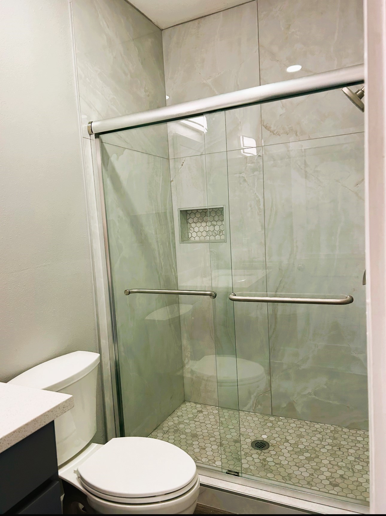 2007 Spring Street Houston, TX 77007 - Photo 14 of 18 a bathroom with a shower and toilet