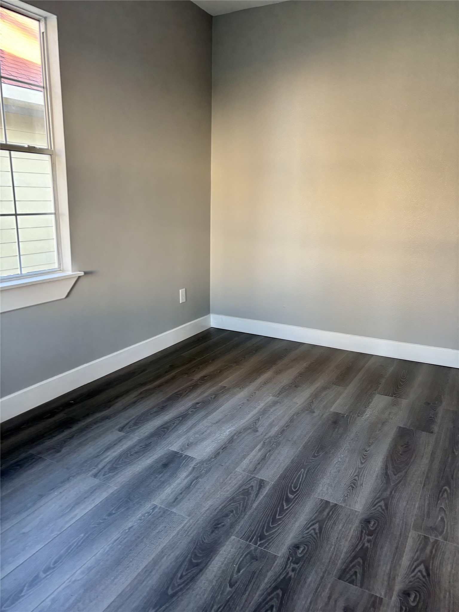 2007 Spring Street Houston, TX 77007 - Photo 10 of 18 wooden floor in an empty room