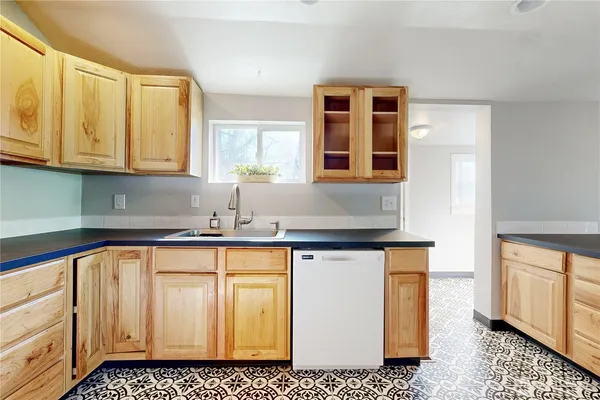 a kitchen with a sink and cabinets