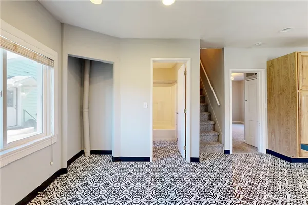 a view of a livingroom with stairs