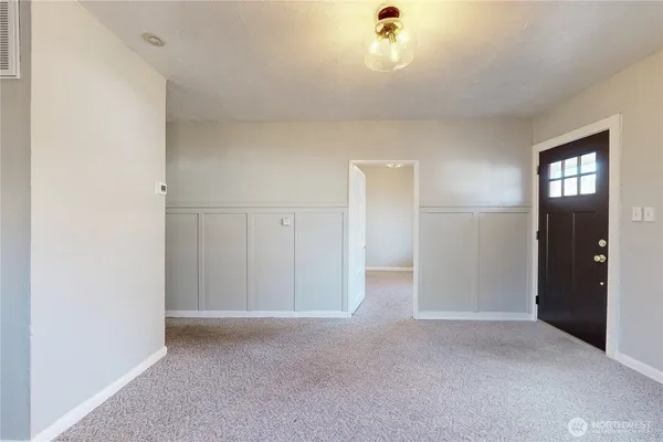 an empty room with closet area