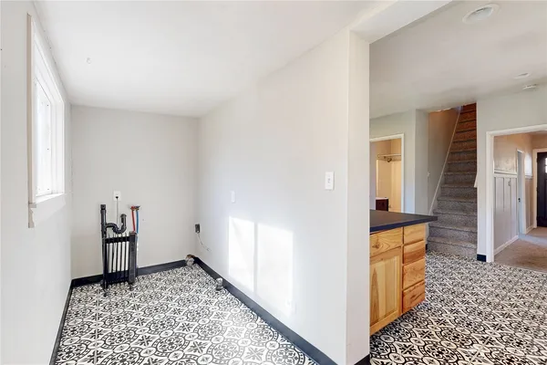 a view of an entryway with a rug
