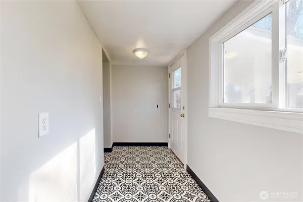 a view of a hallway with a window