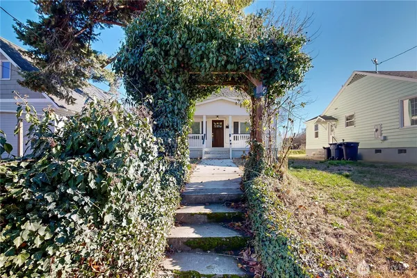 a front view of a house with garden
