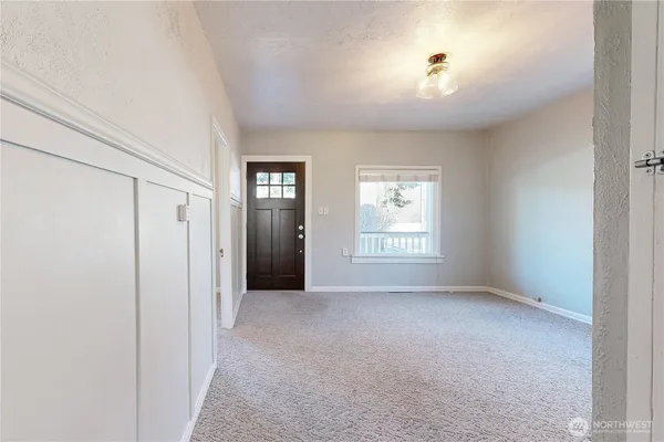 a view of an empty room with a window