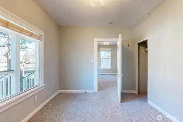 a view of an empty room with a window