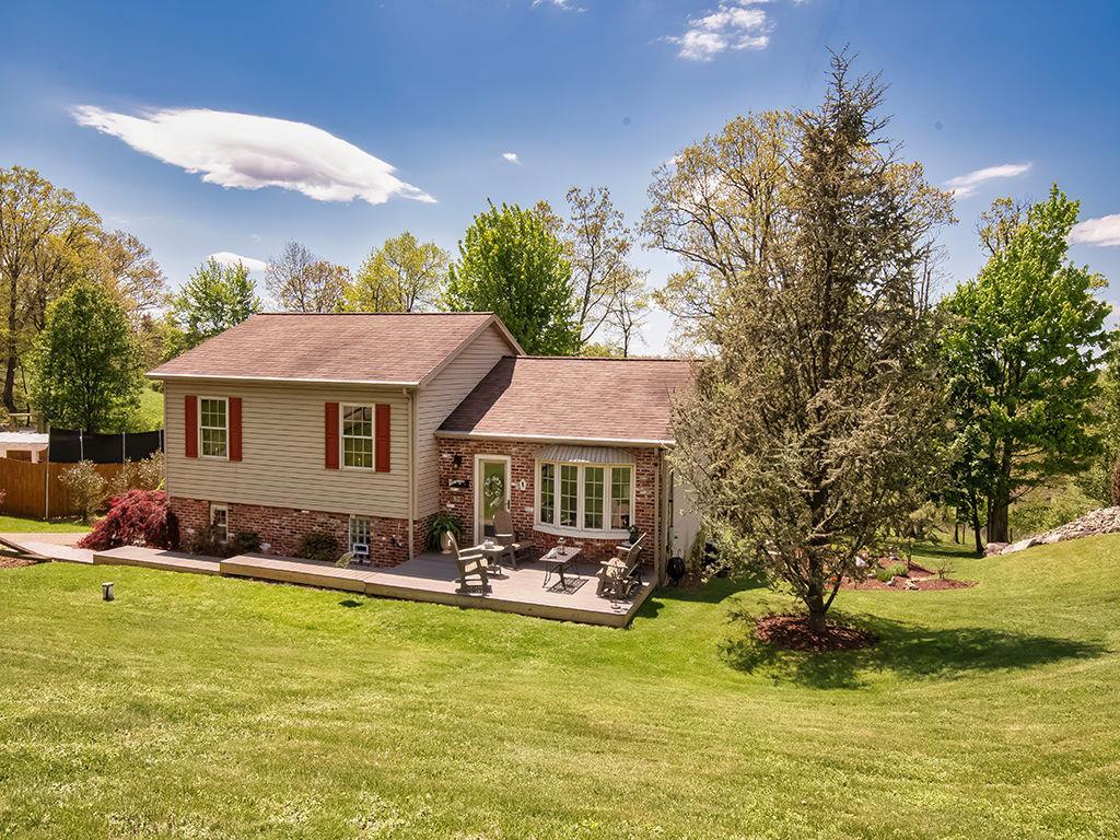 638 Knoll Lane Apollo, PA 15613 - Photo 2 of 30 a front view of a house with a yard table and chairs
