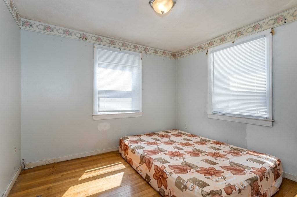 59 Weyham Road Weymouth, MA 02191 - Photo 13 of 18 a bedroom with a bed and a window